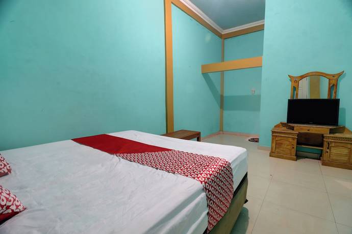 Imagen de la habitación del Hotel Hotel O Rania Kost Simpang Rimbo. Foto 10