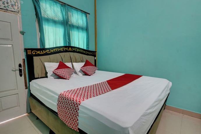 Imagen de la habitación del Hotel Hotel O Rania Kost Simpang Rimbo. Foto 11