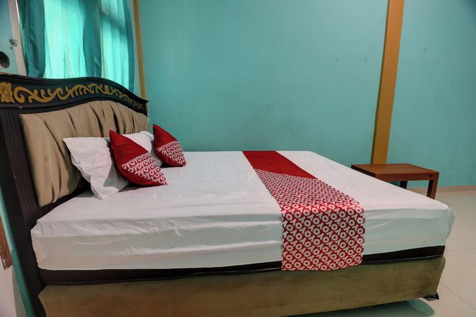 Imagen de la habitación del Hotel Hotel O Rania Kost Simpang Rimbo. Foto 13