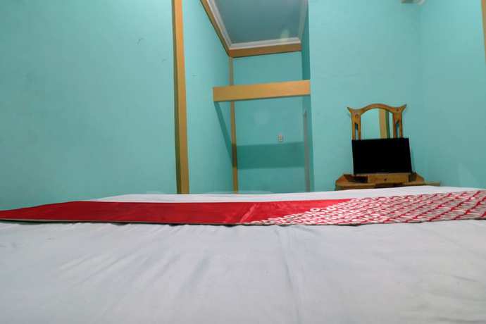 Imagen de la habitación del Hotel Hotel O Rania Kost Simpang Rimbo. Foto 14