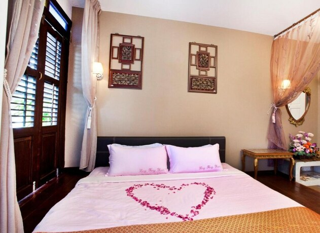 Imagen de la habitación del Hotel Hotel O Vince Villa. Foto 15