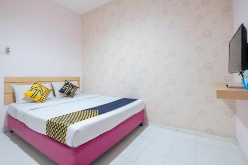 Imagen de la habitación del Hotel Hotel O Wisma Jampea. Foto 13