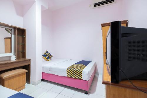 Imagen de la habitación del Hotel Hotel O Wisma Jampea. Foto 16