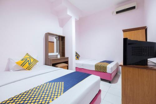 Imagen de la habitación del Hotel Hotel O Wisma Jampea. Foto 17