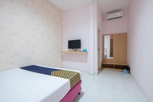 Imagen de la habitación del Hotel Hotel O Wisma Jampea. Foto 19