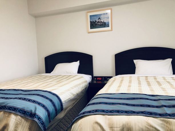 Imagen de la habitación del Hotel Hotel Peace Island Nago. Foto 3