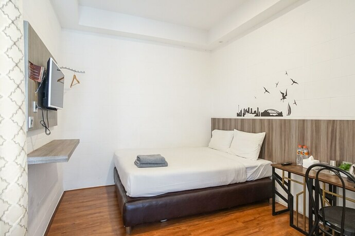 Imagen de la habitación del Hotel Hotel Sanrina Makassar. Foto 10