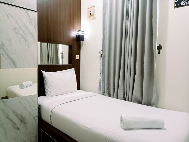 Imagen de la habitación del Hotel Hotel Sanrina Makassar. Foto 28