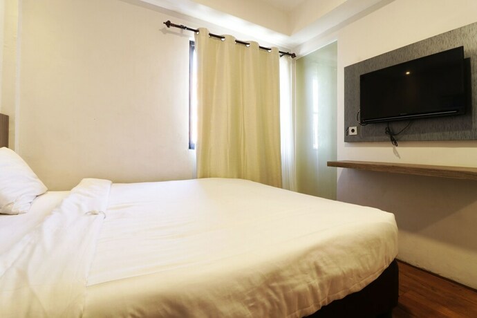 Imagen de la habitación del Hotel Hotel Sanrina Makassar. Foto 31