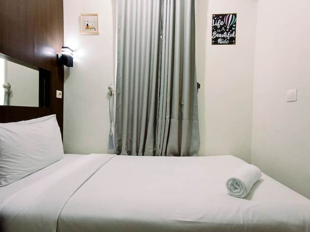 Imagen de la habitación del Hotel Hotel Sanrina Makassar. Foto 41