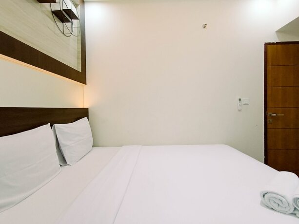 Imagen de la habitación del Hotel Hotel Sanrina Makassar. Foto 43