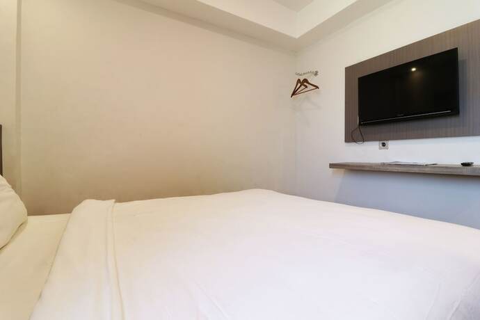 Imagen de la habitación del Hotel Hotel Sanrina Makassar. Foto 53