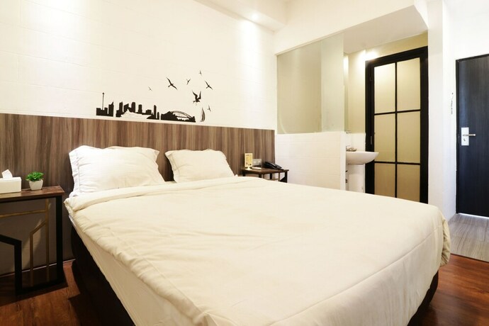 Imagen de la habitación del Hotel Hotel Sanrina Makassar. Foto 61