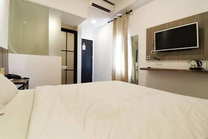 Imagen de la habitación del Hotel Hotel Sanrina Makassar. Foto 63