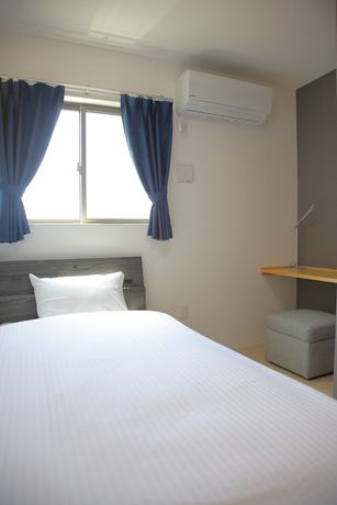 Imagen de la habitación del Hotel Hotel Southern Suite Kugai. Foto 11