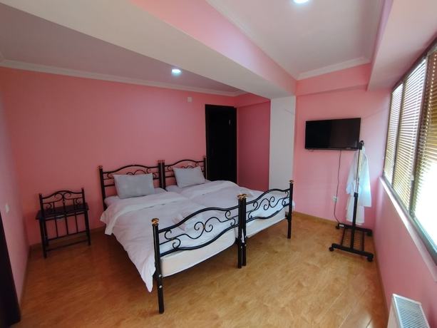 Imagen de la habitación del Hotel Hotel White Magnolia. Foto 7