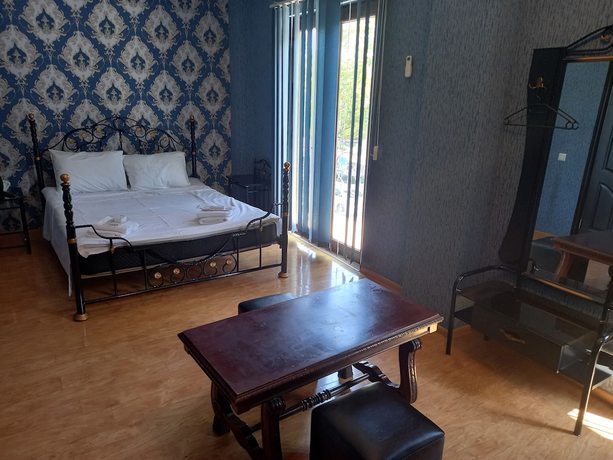 Imagen de la habitación del Hotel Hotel White Magnolia. Foto 11