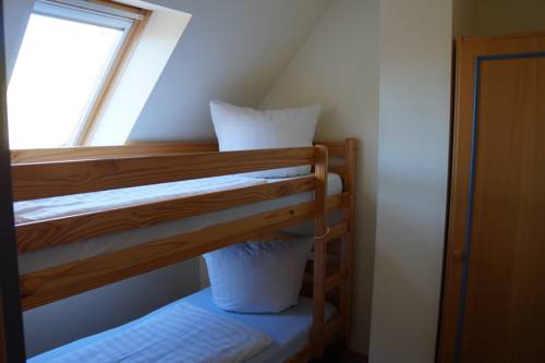 Imagen de la habitación del Hotel Hotel- & Ferienanlage Kapit&auml;ns-h&auml;user Breege. Foto 7