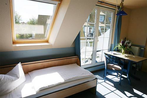 Imagen de la habitación del Hotel Hotel- & Ferienanlage Kapit&auml;ns-h&auml;user Breege. Foto 13