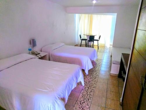 Imagen de la habitación del Hotel Hotelito Escondido. Foto 8