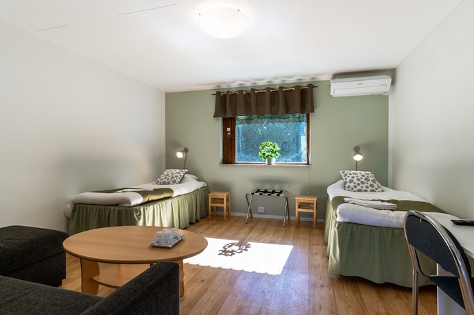 Imagen de la habitación del Hotel H&ouml;llviksn&auml;s m&ouml;ten mat logi. Foto 11