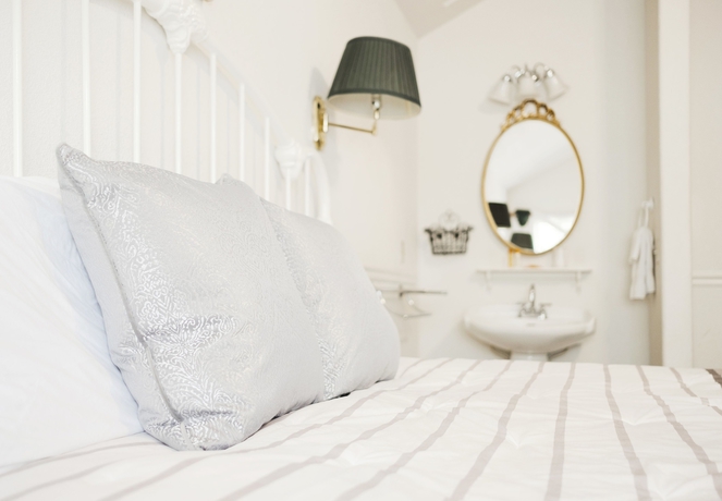 Imagen de la habitación del Hotel Hounds Tooth Inn. Foto 15