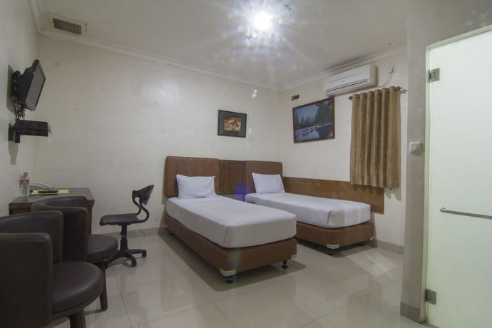 Imagen de la habitación del Hotel House Of Arsonia Flamboyant. Foto 5