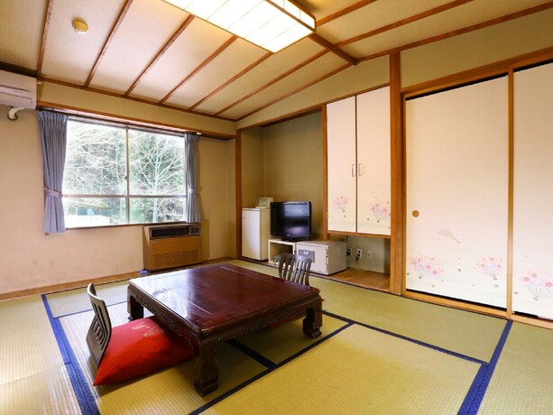 Imagen de la habitación del Hotel Housei. Foto 24