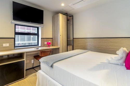 Imagen de la habitación del Hotel Housi Paulista. Foto 14