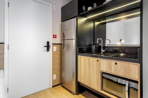 Imagen de la habitación del Hotel Housi Paulista. Foto 15