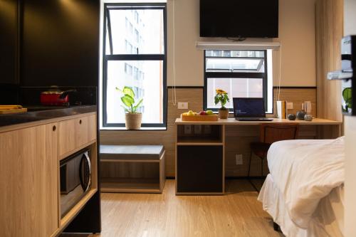 Imagen de la habitación del Hotel Housi Paulista. Foto 18