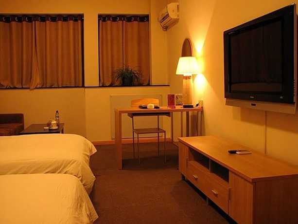 Imagen de la habitación del Hotel Housing Urban Zibo. Foto 3