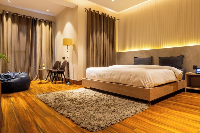 Imagen de la habitación del Hotel Housr Golf Course Road Phase 1 Metro. Foto 2