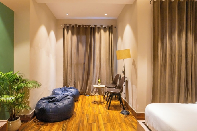 Imagen de la habitación del Hotel Housr Golf Course Road Phase 1 Metro. Foto 3