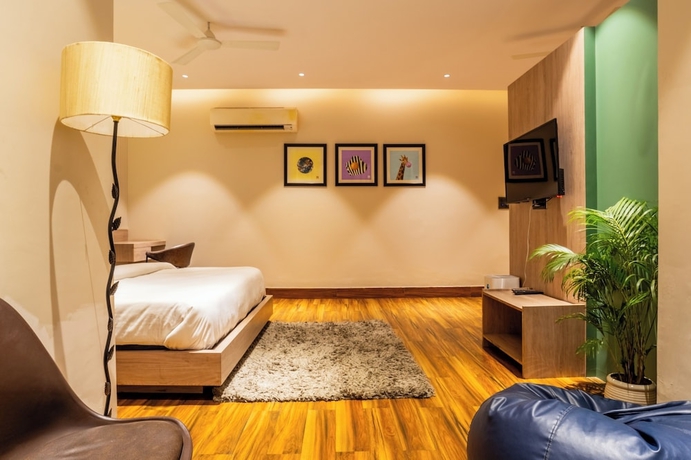 Imagen de la habitación del Hotel Housr Golf Course Road Phase 1 Metro. Foto 8