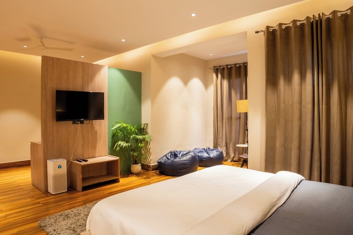 Imagen de la habitación del Hotel Housr Golf Course Road Phase 1 Metro. Foto 9