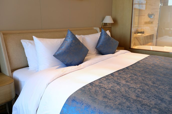 Imagen de la habitación del Hotel Howard Johnson By Wyndham Jimei Lake Plaza Xiamen. Foto 11