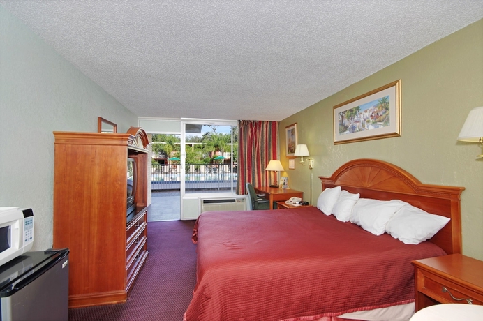 Imagen de la habitación del Hotel Howard Johnson By Wyndham Tropical Palms Kissimmee. Foto 6
