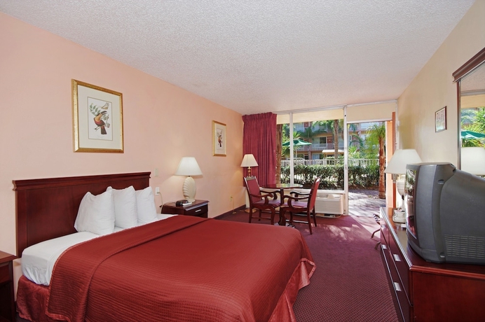 Imagen de la habitación del Hotel Howard Johnson By Wyndham Tropical Palms Kissimmee. Foto 14
