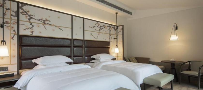 Imagen de la habitación del Hotel Howard Johnson Huashuiwan Hot Springs Resort Chengdu. Foto 7