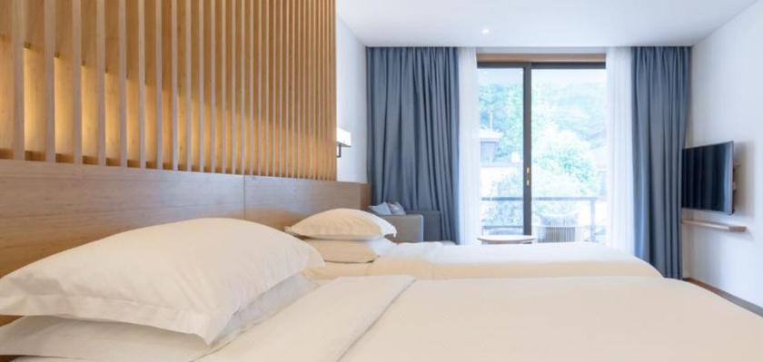 Imagen de la habitación del Hotel Howard Johnson Huashuiwan Hot Springs Resort Chengdu. Foto 8