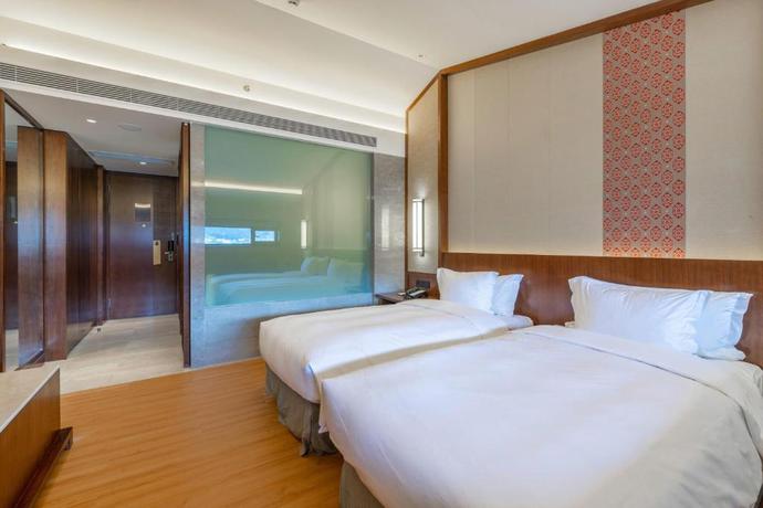 Imagen de la habitación del Hotel Howard Johnson Neodalle Resort Zhangjiajie. Foto 7