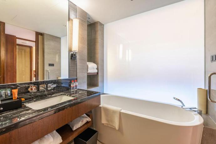 Imagen de la habitación del Hotel Howard Johnson Neodalle Resort Zhangjiajie. Foto 8