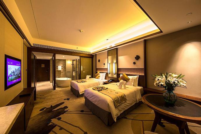 Imagen de la habitación del Hotel Howard Johnson Neodalle Resort Zhangjiajie. Foto 9