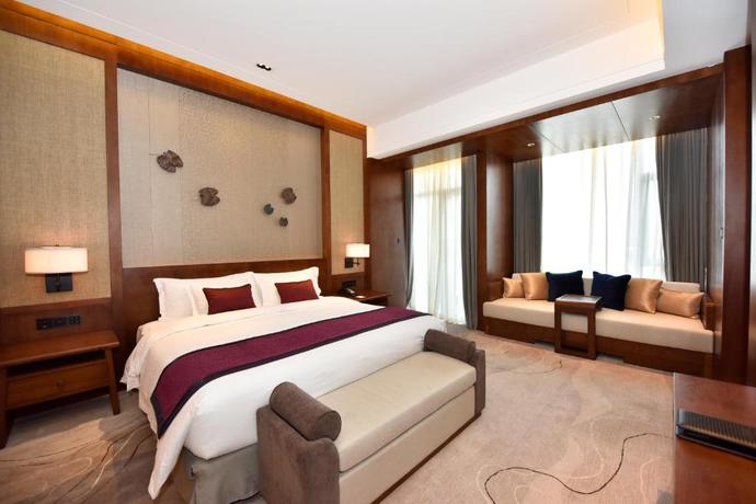 Imagen de la habitación del Hotel Howard Johnson Neodalle Resort Zhangjiajie. Foto 10