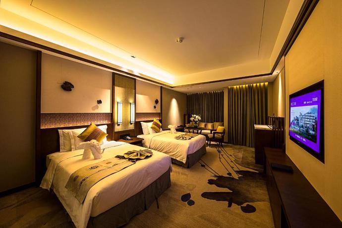 Imagen de la habitación del Hotel Howard Johnson Neodalle Resort Zhangjiajie. Foto 14