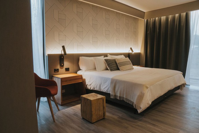 Imagen de la habitación del Hotel Howard Johnson Plaza La Ribera. Foto 15