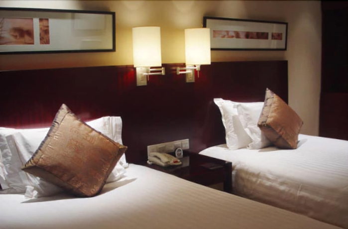 Imagen de la habitación del Hotel Howard Johnson Plaza Lingang Shanghai. Foto 10