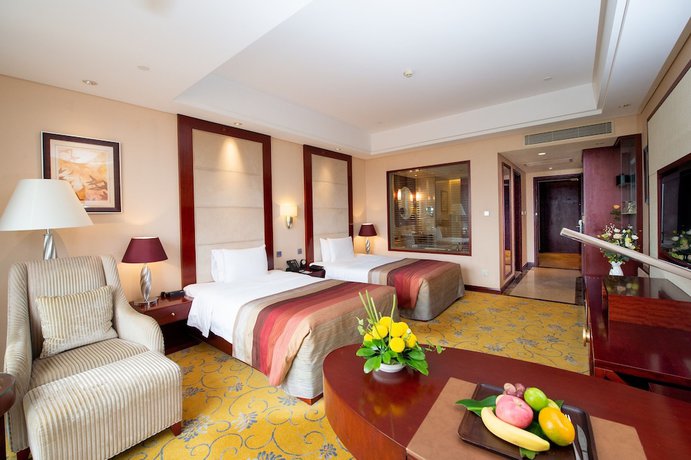 Imagen de la habitación del Hotel Howard Johnson Tropical Garden Plaza Kunming. Foto 16