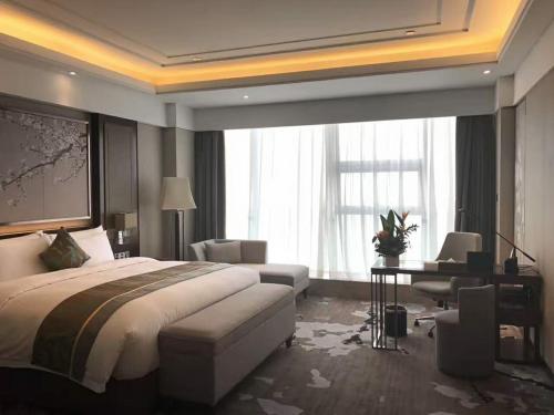 Imagen general del Hotel Howard Johnson Xiangyu Plaza Linyi. Foto 1